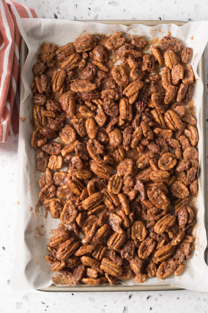 Pecans that have been evenly coated with sugar and cinnamon and baked in the oven like TikTok says to do!
